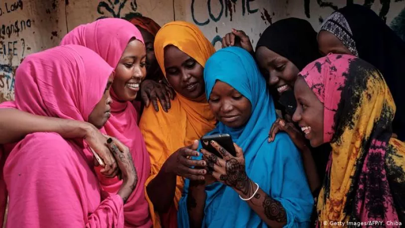 Women using a mobile phone.