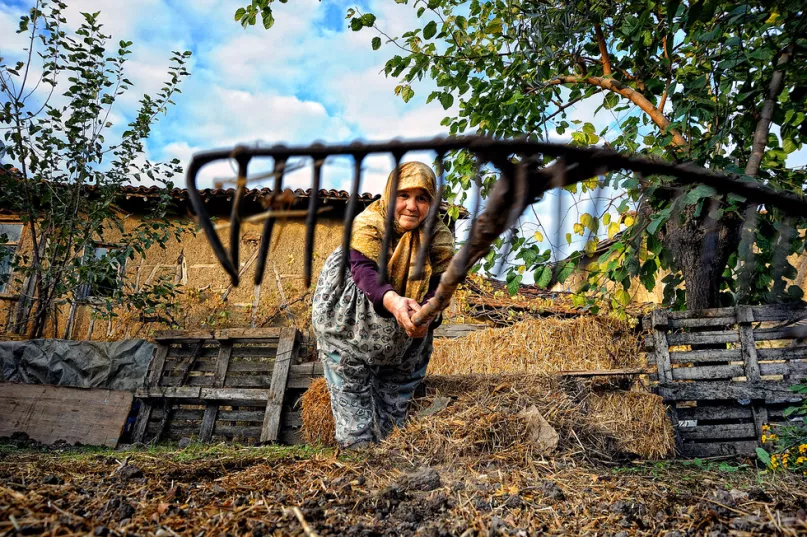 Farmer with scythe. Photo credit: Bulent Suberk, 2015 CGAP Photo Contest.