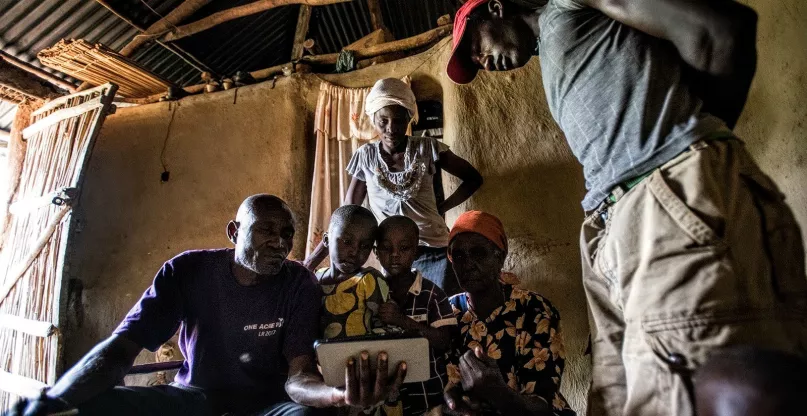 Video marketing with tablet, Kenya. Photo credit: Hailey Tucker, 2017 CGAP Photo Contest.
