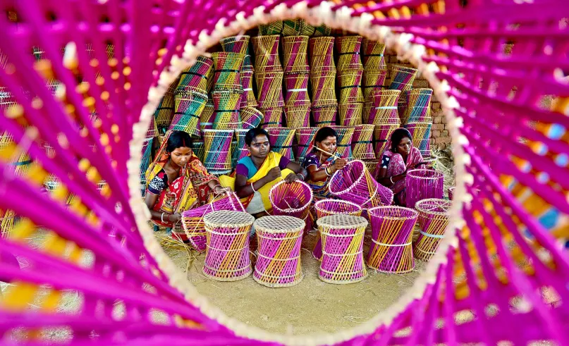 Women making bamboo stools, India. Photo credit: Santanu Das, 2017 CGAP Photo Contest.