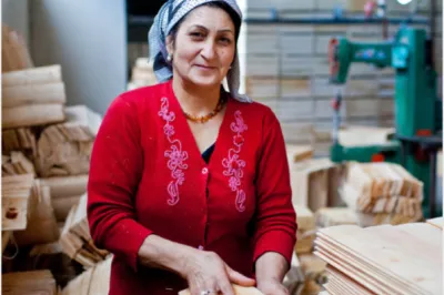 A woman working with wood. SEEP photo. 