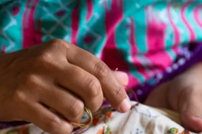 A woman's hands stitching.