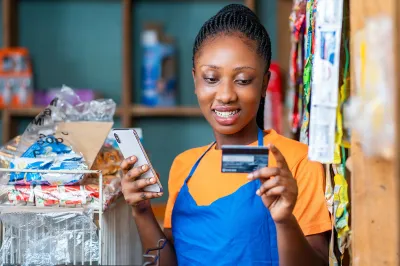 Young woman using mobile phone.