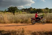 Man on motorcycle, Mozambique. Photo by Allison Shelly for CGAP.