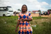 Magdalene, a primary school teacher and mother, is part of a women's lending circle and regularly uses digital financial services on her mobile phone. Photo by Caroline Gutman, 2018 CGAP Photo Contest.