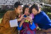 Youth with cellphone, Bhutan. Photo credit: Anindya Majumdar, 2017 CGAP Photo Contest.