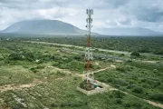 Mobile money tower in rural landscape