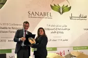 نجوى قبطي، مديرة التعلم والتطوير، شركة صندوق المرأة، الأردن عند استلام جائزة سنابل لعام 2018. 
