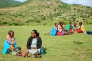 Rose Lelesiit (left) talking to her BOMA Village Mentor Sarah Sein Lanyasunya, in Maralal, Kenya at a meeting of Rose’s Savings Group. Photo credit: Jane Klonsky for the BOMA Project.