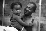 Father and daughter, Haiti. Photo credit: Tim Chambers, 2016 CGAP Photo Contest.