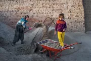 Mother working in a brick workshop brings her daughter to work, Iran. Photo credit: Kaveh Zakaryaei Nejad, 2017 CGAP Photo Contest.
